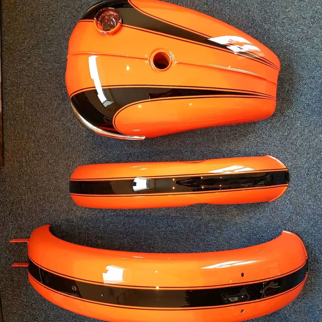 Orange Triumph motorbike custom paint job 3
